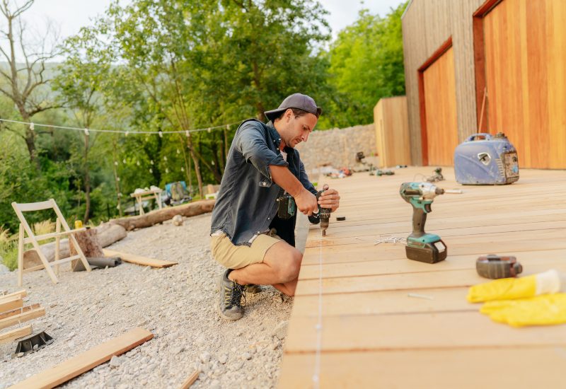 A contractor restoring home deck of a residence in Annapolis, MD