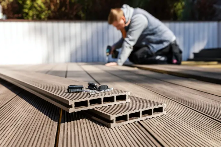 Professional installing a composite deck on a house in Annapolis, MD